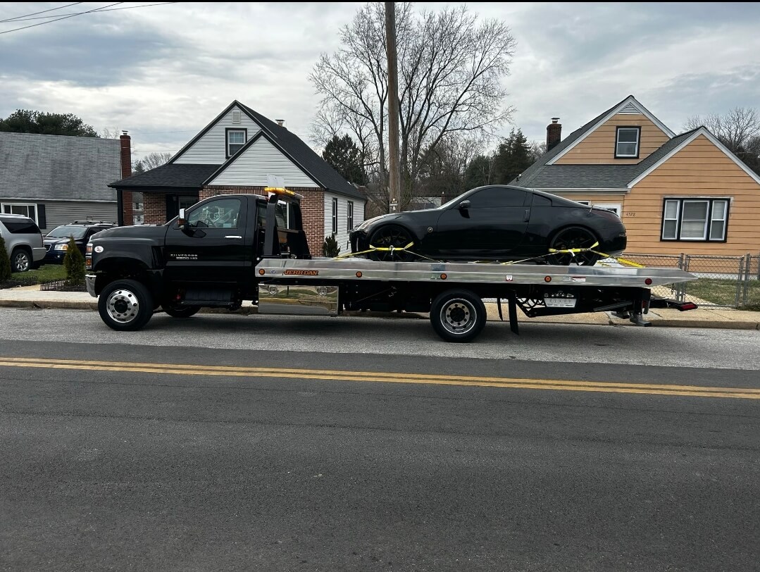 Winch-out service helping stuck vehicle